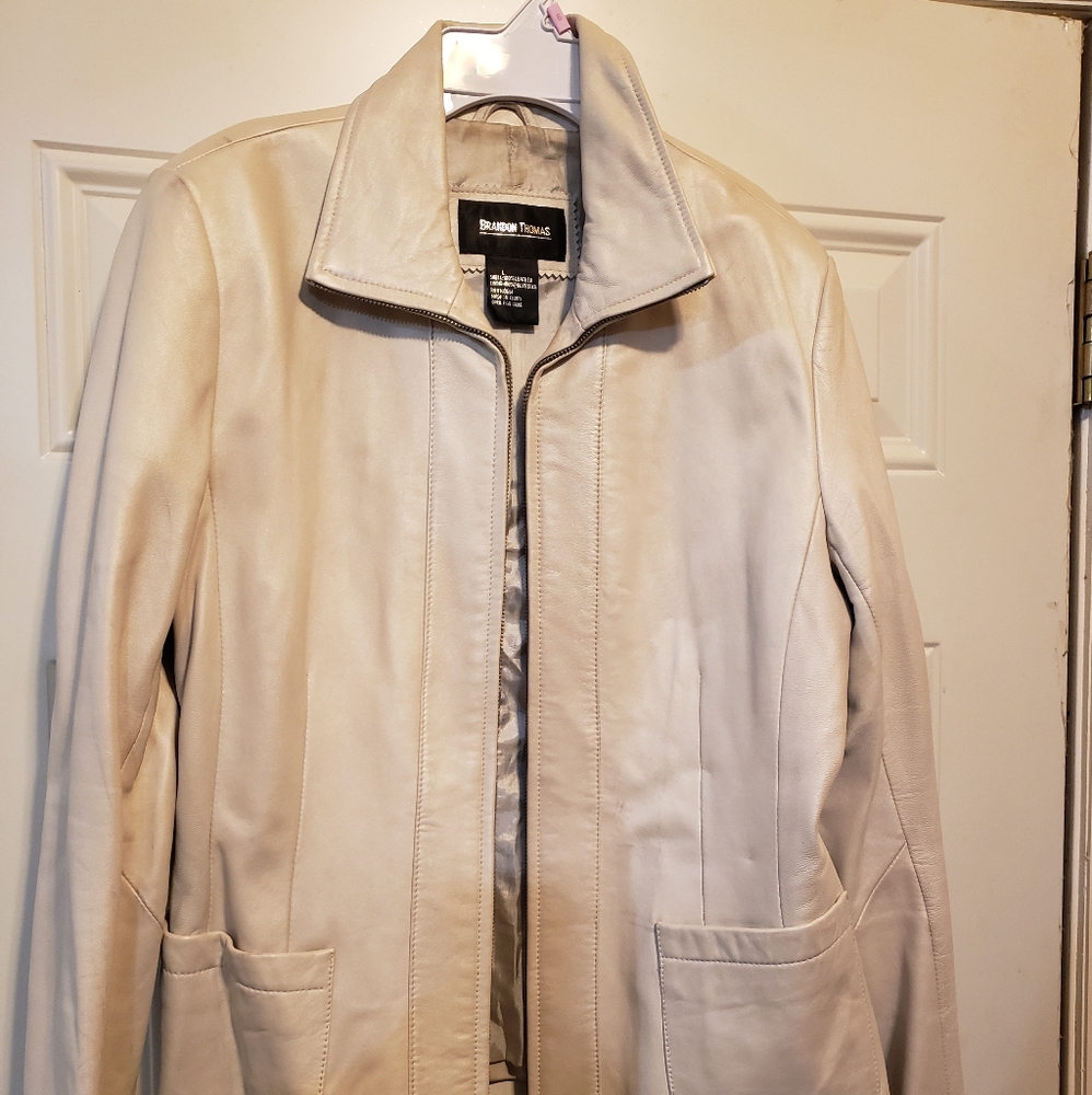 Cream/off white leather jacket.